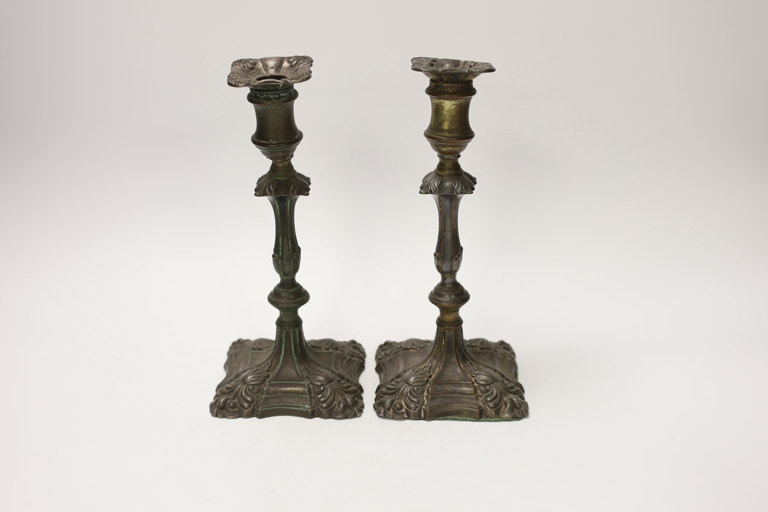 A pair of late 18th century Old Sheffield plate candlesticks, 24cm high